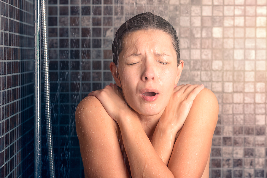 woman taking cold shower